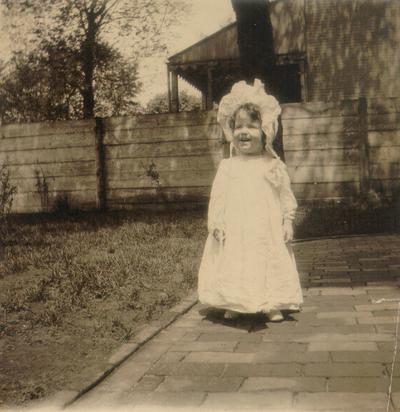 Small child standing outside