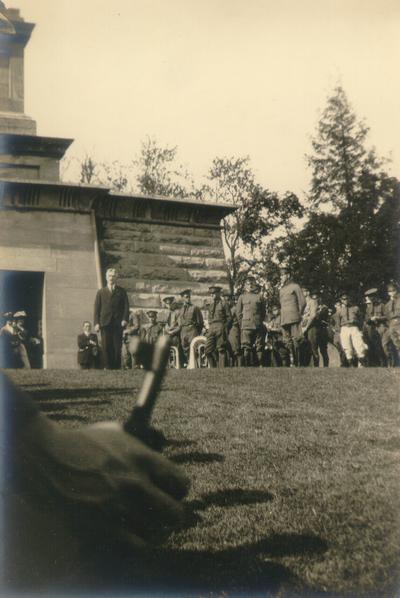 Samuel M. Wilson in center, surrounded by men in uniform (at ceremony)