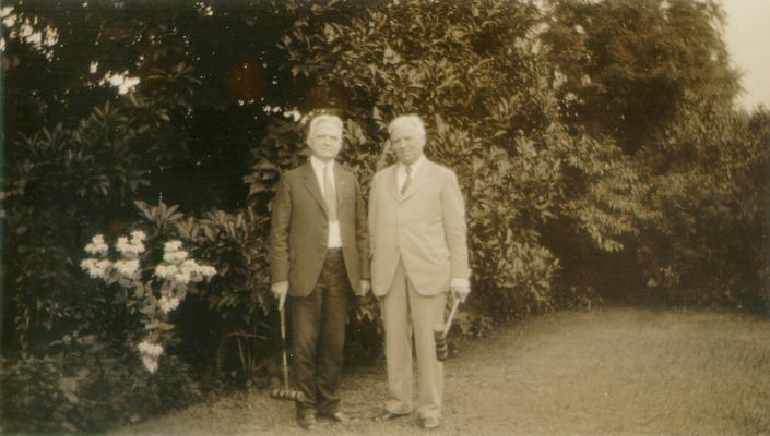 Samuel M. Wilson and a man standing in a garden