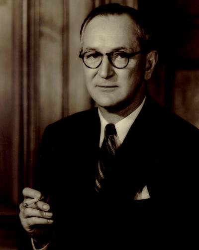 Portrait of a man holding a cigarette