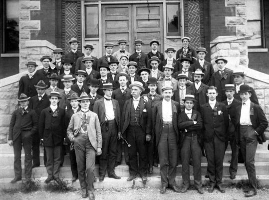 Large group of men on steps