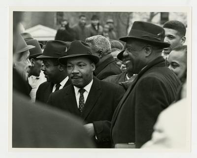 Dr. Martin Luther King, Jr., standing in a crowd