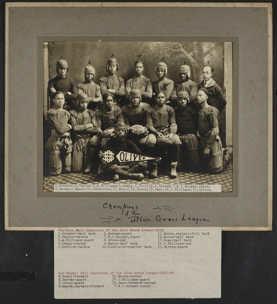 African American football team and coach E.J. Hooper at Oliver High School in Winchester, Kentucky ; written on photograph border, 