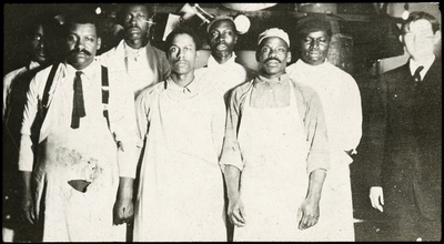 Group of unidentified African American men and one caucasian man