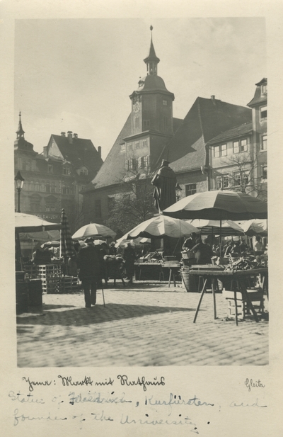 Buildings, tables outside.  