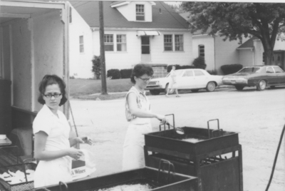 Series S41: Taylorsville, Southern States fish fry, women frying fish outside