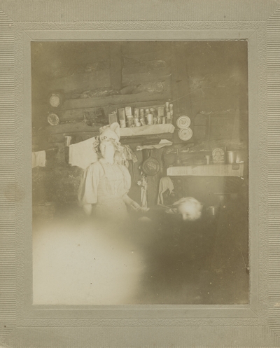 woman in log cabin