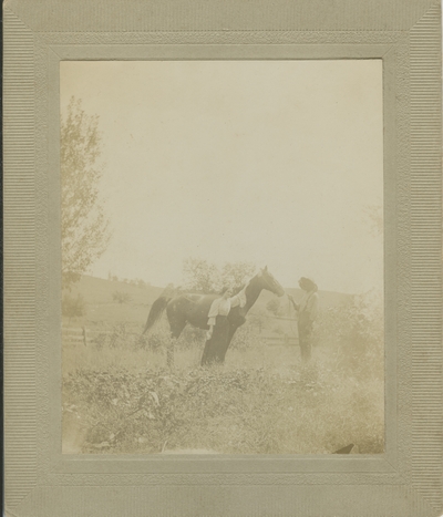 man and woman with horse