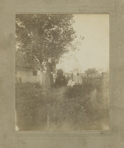 three women standing outside