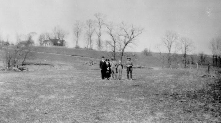 Group standing by site of abandoned saltwater wall, near middle of 'piece of low ground remarkable for English grass,' on Grassy Lick Creek in Montgomery County, KY