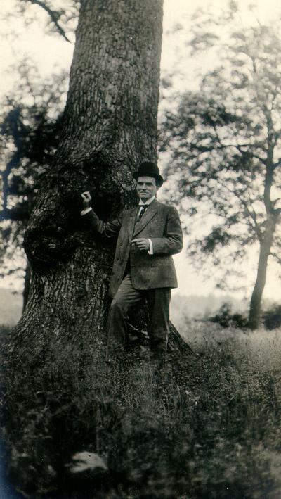 Payne's Depot. Samuel M. Wilson standing next to tree