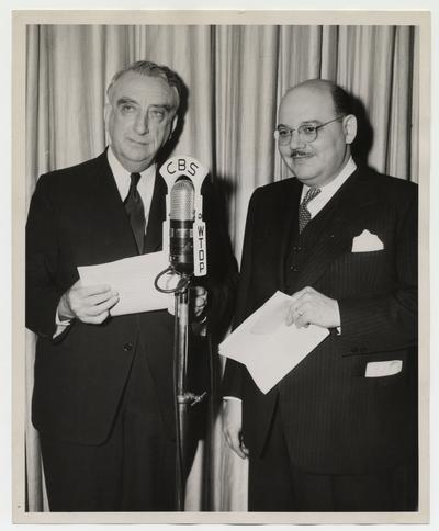 Treasury Secretary Vinson with CBS Radio announcer behind CBS microphone