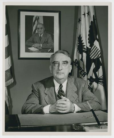 Secretary Vinson seated at his desk