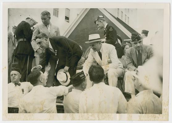 Secretary Vinson shakes hands at outdoor American Legion gathering