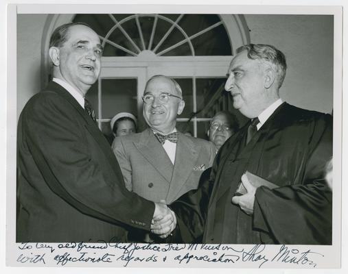 Swearing-in ceremony of Sherman Minton to become associate justice of Supreme Court, in handshake with Chief Justice Vinson with President Truman in center