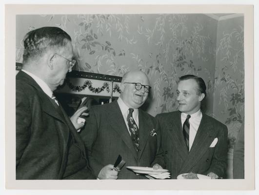 Three unidentified men, center