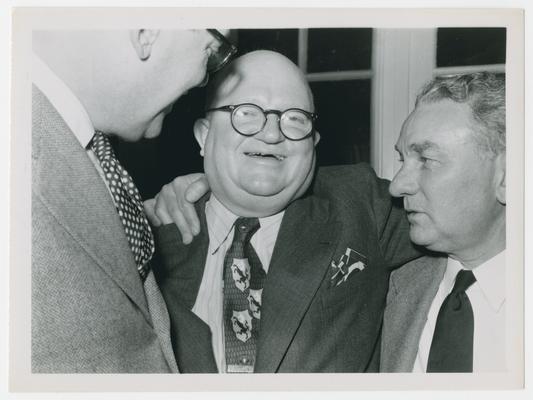 Three unidentified men, center