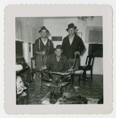 Unidentified hunter with children