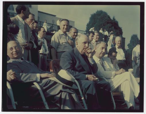 Chief Justice Vinson, center, and Justice Clark, right of Vinson among crowd at outdoor event