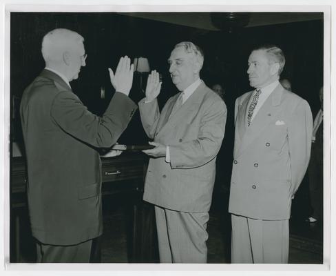 Chief Justice Vinson swears in unidentified man