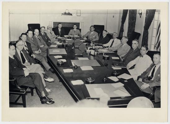 Truman Cabinet. Left to right: Clinton Anderson, Secretary of Agriculture; L.M. Schwellenburg, Secretary of Labor; John B. Blandford, Jr., National Housing Advisor; J.A. Krug, WPB Chairman; John W. Snyder, Director Economic Stabilization; Leo Crowley, Foreign Economic Advisor; Henry A. Wallace, Secretary of Commerce; Abe Fortas, Under Secretary of Interior; Robert Hannegan, Postmaster General; H.L. Stimson, Secretary of War; James F. Byrnes, Secretary of State; Harry Trueman, President; Secretary Vinson; Thomas Clark, Attorney General; James Forrestal, Secretary of Navy