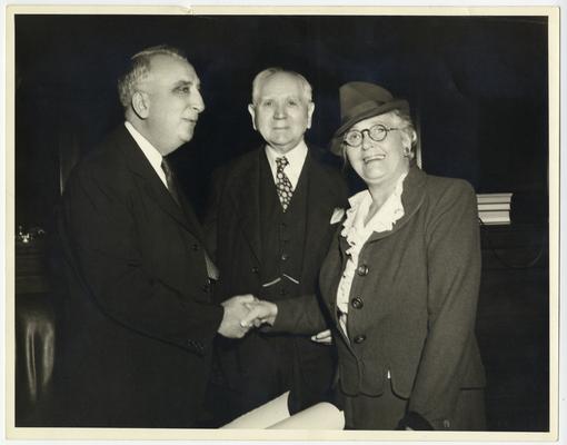 Chief Justice Vinson with unidentified man and woman