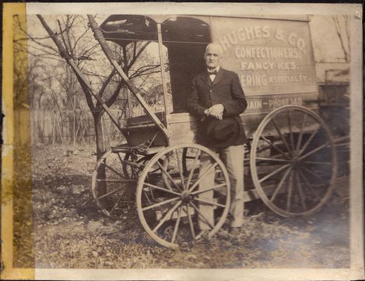 William Hughes in front of Hughes and Co. wagon