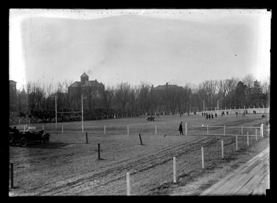 View of field, Jubilee game, from Rose Street, Barker Hall and old Education (Frazee) Building in background