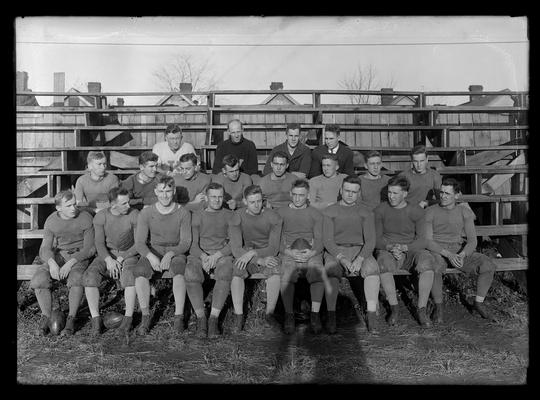 Football team on bleachers, Coach Tigert