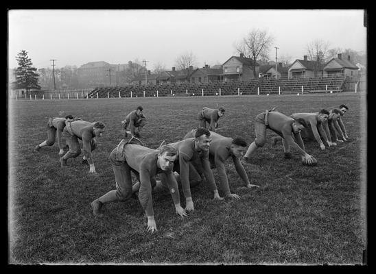 Football team, ready for the snap, the play