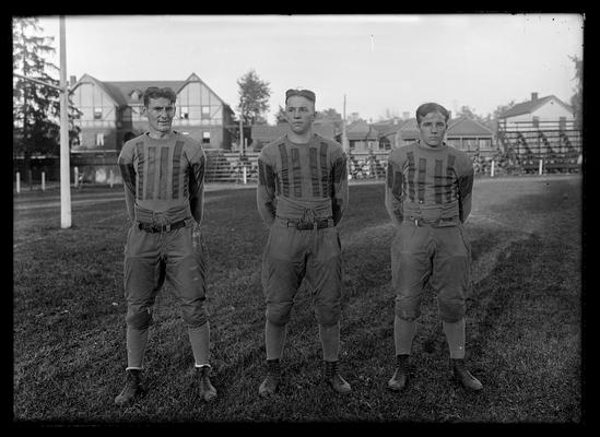 Three football players, Kenneth King, left