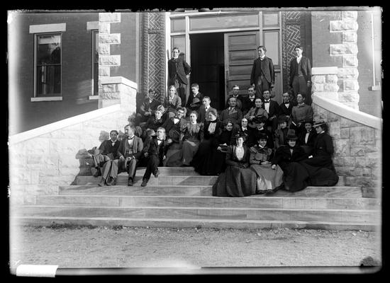 Notation Class in Botany (sophomore) Oct 1898 approcimately, co-ed, on steps of Miller Hall, three standing
