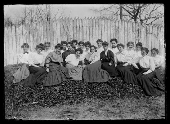 Young Women's Christian Association (YWCA), informal picture by picket fence, 1906-1907