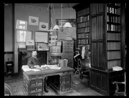 Professor M.A. Scovell, Director of Agricultural Experiment Station in his office