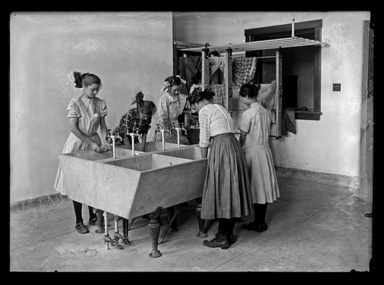 Lincoln School, girls washing in the laundry, for Mrs. Breckinridge
