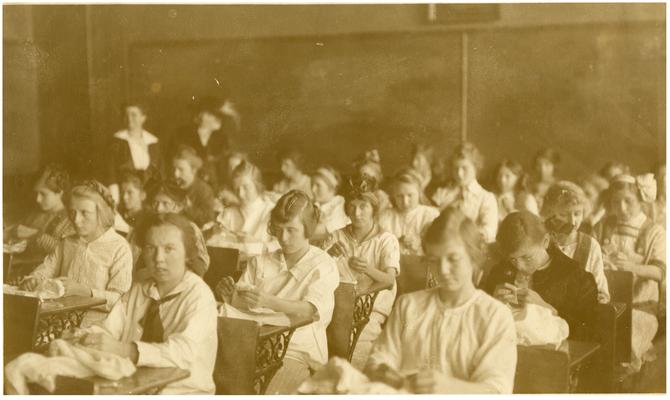 Greendale girls' sewing class. Handwritten on verso, A sewing class at Greendale Consolidated school in Fayette County, Kentucky. (Two copies)