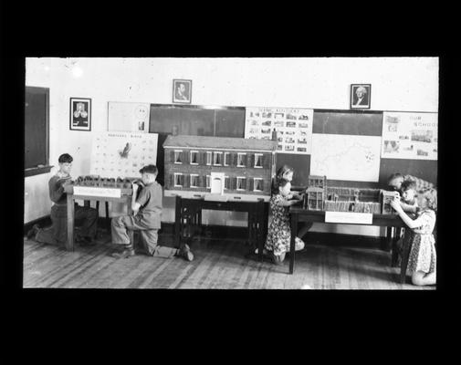 Elementary school students in classroom with Kentucky history projects