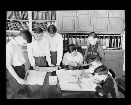 Junior High school students building a model airplane