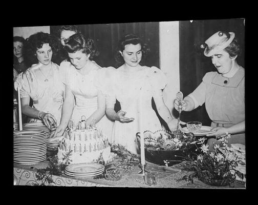 Senior High School student presenting flowers to Miss Margaret McCubbing