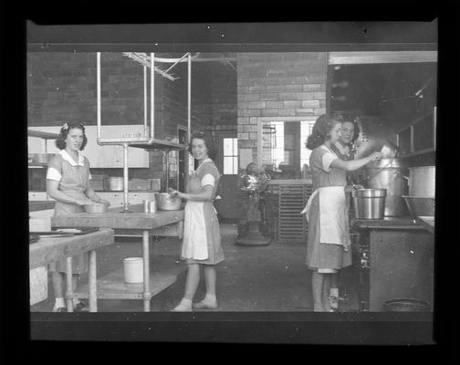 Cafeteria workers prepare food in Lafayette kitchen