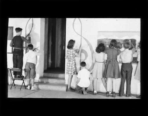 Kenwick students painting a mural