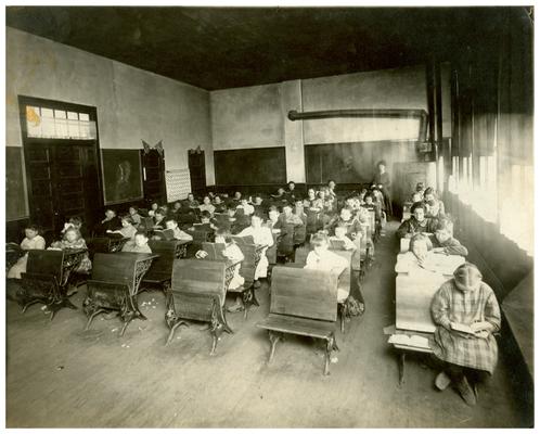 Group portrait of Loradale students sitting at their desks. Handwritten on verso, Loradale (Three copies)