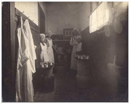 Loradale kitchen help standing in the kitchen. Handwritten on verso, Loradale.(Six copies)