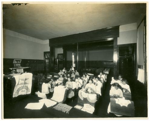 Picadome girls' sewing class. Handwritten on verso, Exhibit of sewing done by the class of 1914 at Picadome rural school, Fayette County, Ky. (Three copies)