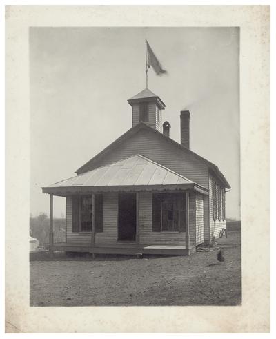 Exterior of the South Elkhorn school house. Handwritten on verso, S. Elkhorn. (Two copies)