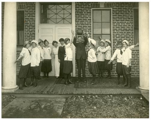 Group portrait of Picadome girls' basketball team, in various game related poses, with Nannie Faulconer (1865?-1940)