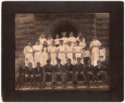 Group portrait of the graduating class of 1906 with Mrs. Nannie Faulconer (1865?-1940)