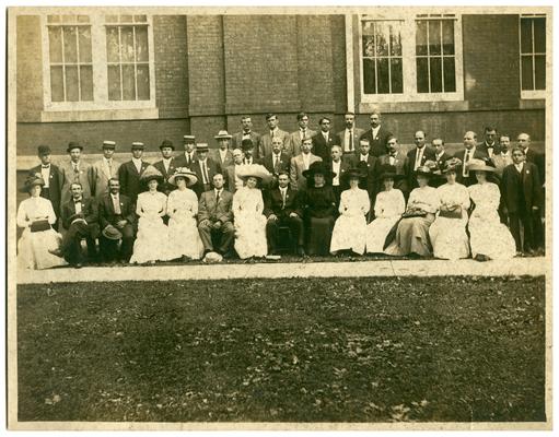 Group portrait taken in 1910 with Nannie Faulconer (1865?-1940)