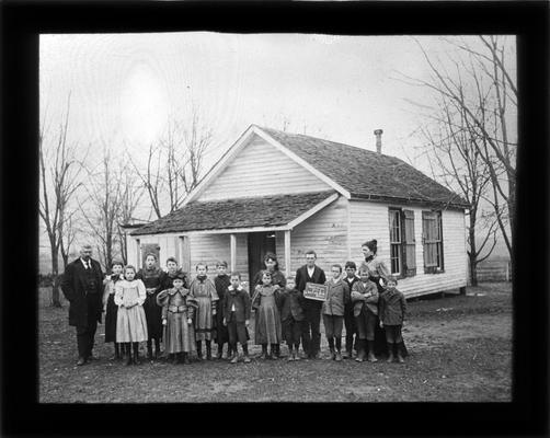 Students outside Maple Grove School on Sandersville Pike with Miss Lula Keith, teacher, and M.A. Cassidy, superintendent of Fayette County Common Schools