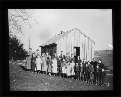 Students outside Jack's Creek School with Miss Maude Spears, teacher